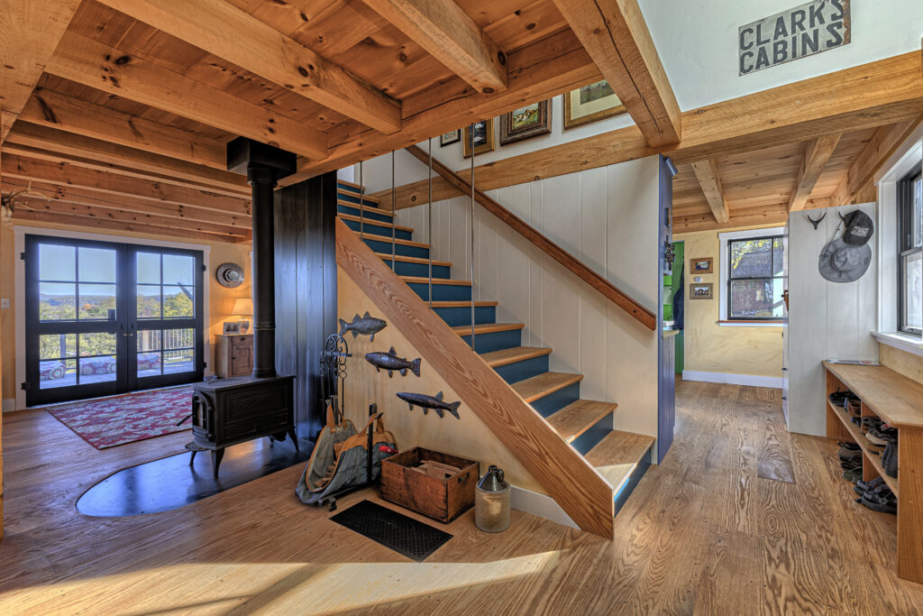 Interior of the first floor of small Cape home built by Early New England Homes, looking at the stairs.