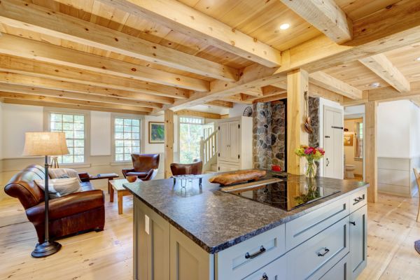 Interior image of the kitchen and living room of a Cape Cod style home from Early New England Homes.
